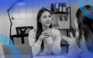 A woman giving feedback to her colleague.