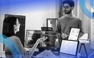 Two employees brainstorming AI solutions
