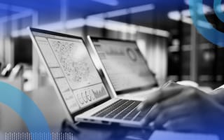A closeup of a person's hands working on a laptop showing business intelligence tools