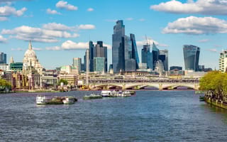 A view of the London skyline featuring Blackfriars Bridge over the River Thames with skyscrapers in the background.