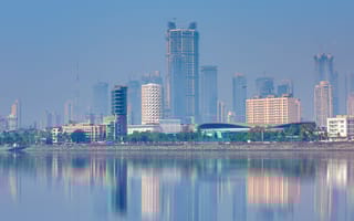 The Mumbai, Maharashtra skyline along the water.