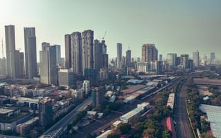 An aerial view of the Mumbai financial district featuring several skyscrapers.
