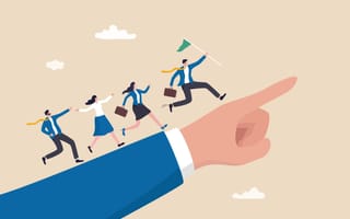 A manager leads a team in the direction indicated by a leader's finger.