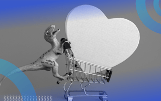 A toy dinosaur pushing a tiny shopping cart with a big heart in it.