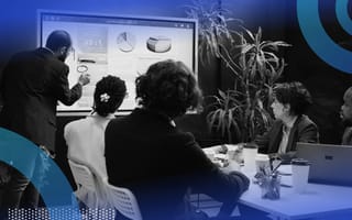 An advisory board watching a presentation.