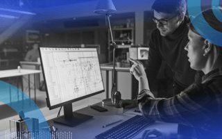 When Should You Embrace Low- or No-Code Solutions? Two engineers work together on a desktop computer