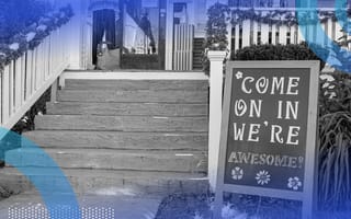 A sign in front of a store says Come On In, We're Awesome.