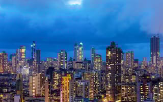 A skyline view of Mumbai at night.