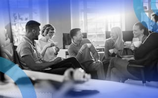 A group of young professionals drink coffee together