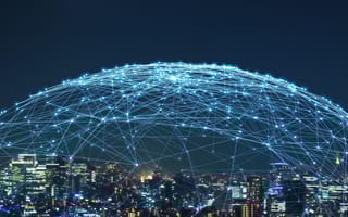 A network expands over a city.