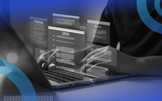 A close-up of someone typing on a laptop with holographic images of the coding programs Python, JAVA and C++.