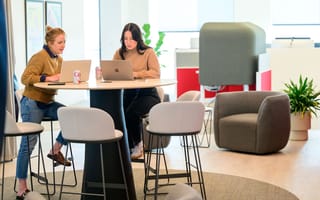 Two CarGurus employees meet in a collaboration space in the company’s new global headquarters inside Boston’s new Lyrik Back Bay project at 1001 Boylston Street.