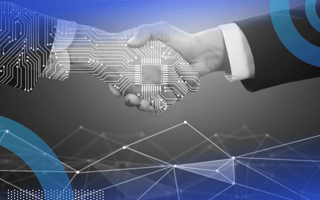 A human hand and a digital hand shaking hands.