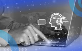 A close-up of someone typing on a laptop with a holographic outline of a head representing agentic AI.