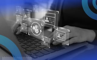 A developer works on a laptop with a digital overlay