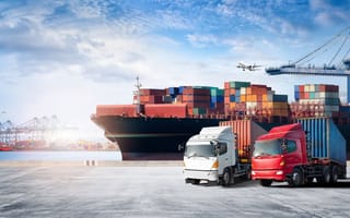 container ship, cargo trucks and cargo plane