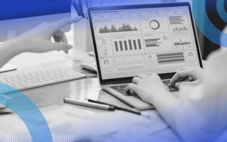 Two marketers reviewing a platform with data