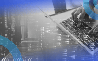 What Is Software-Defined Networking? A closeup on an engineer working on a laptop with an overlay of code