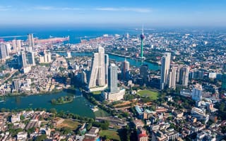 An aerial view of Colombo on a bright blue day.