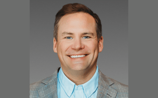 A headshot of Motive CRO Adam Block is shown.