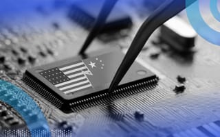 A computer chip is placed on a motherboard with images of the American and Chinese flags on it