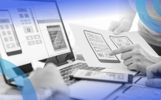 Two UX designers reviewing design icons for an app