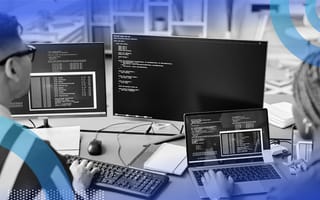 Two developers reviewing code files