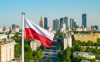 Polish flag flying above the city.