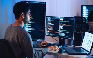 Software developer works on new code..