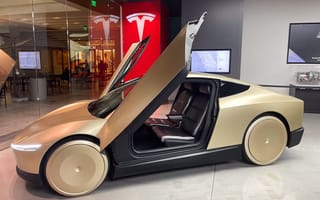 A photo of the Cybercab in a Tesla showroom.