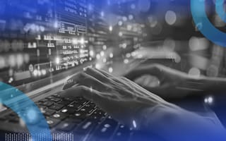 A developer works on a keyboard with a stylized code overlay