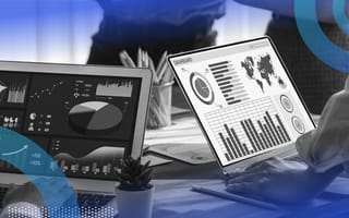 Multiple laptops with data visualizations onscreen