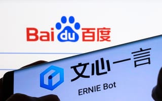 Baidu's homepage on a desktop computer, with Baidu's ERNIE Bot pulled up on a smartphone in the foreground