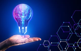 Conceptual image of a person's hand. A lightbulb floats above it.