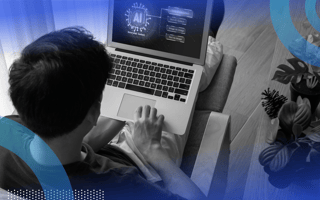 A worker uses generative AI on a laptop