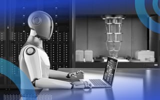 A robot works on a laptop