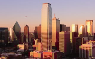 The Dallas skyline as sunset is pictured.