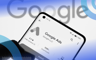 A smartphone with the Google Ads logo in front of the Google logo