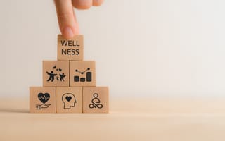 Wooden building blocks representing mental wellness.