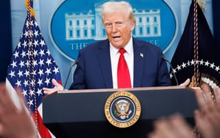 Trump stands at a podium in the white house press room.