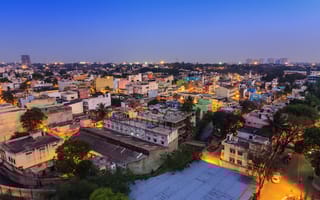 A bird's eye-view shot of Bengaluru skyline at nighttime.