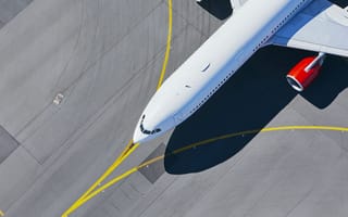 Aerial view of a plane on a runway.