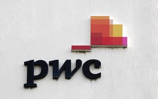 A close up of the PwC logo on the side of a building.