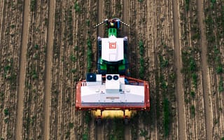 Aerial view of a Carbon Robotics Carbon AutoTractor moving across a field