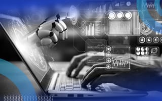Closeup of hands typing on a laptop with a robot hand emerging from the screen