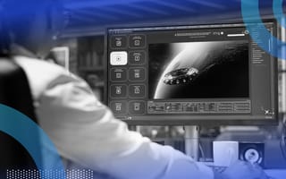 A woman works with a generative AI model on a desktop computer