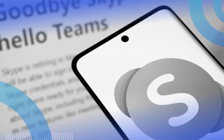 A smartphone with the Skype logo in front of a news item about its closure