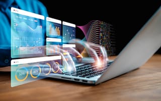 Hands typing on a laptop keyboard overlaid by various analytics illustrations.