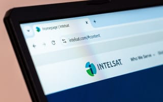 Close-up of a laptop screen showing a web browser with the Intelsat homepage.