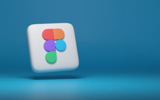The Figma logo is illustrated on a 3D surface.